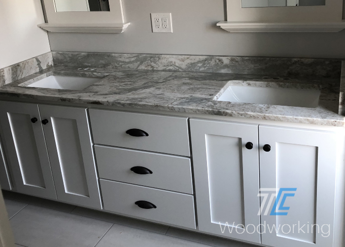 white double sink vanity, grey marbled counter, white sinks